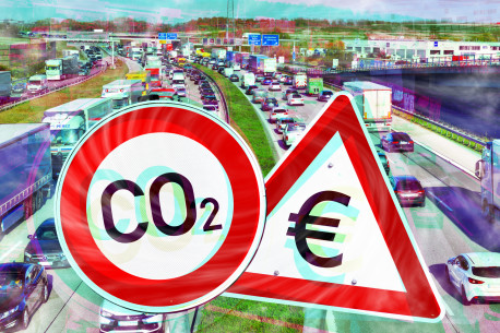 Autobahn und Schilder mit Eurozeichen und Aufschrift CO2, Symbolfoto CO2-Steuer.